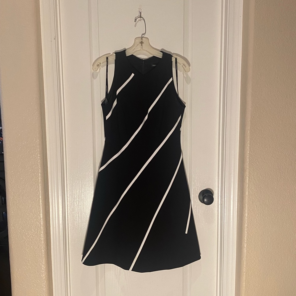 Karen Millen dress- Black dress with white vertical stripes. Size 8